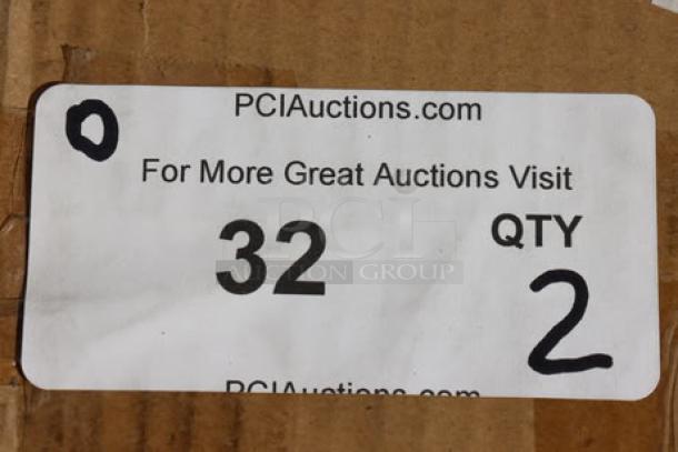 Label on cardboard box showing "PCI Auctions," quantity 2, and item number 32.