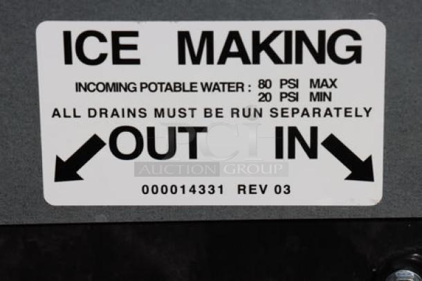 BRAND NEW SCRATCH-N-DENT Manitowoc IDT1500A ice machine tag indicating water pressure and drain instructions.