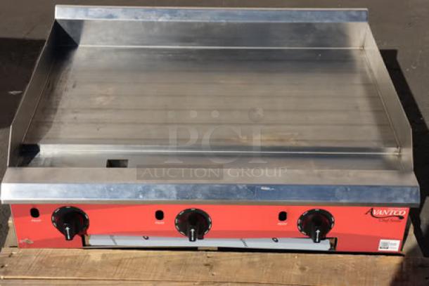 Brand new Avantco Chef Series CAG-15-TG 15" gas griddle, thermostatic controls, 35,000 BTU, minor scratches.