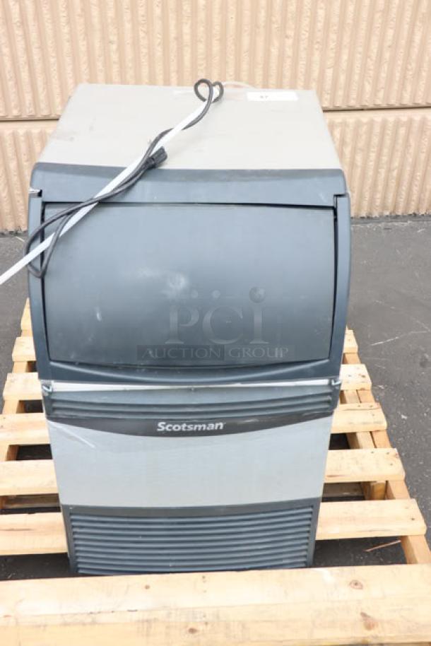 Brand new Scotsman UN1520A-1A 20" air-cooled undercounter nugget ice machine with 57 lb. bin, slight cosmetic scratches.