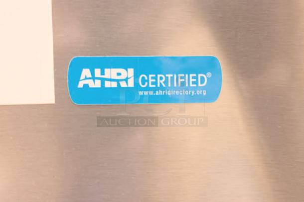 Alt text: Scotsman undercounter nugget ice machine, model HID312ABX - 1A, 20" air-cooled, 57 lb. bin, AHRI certified label visible.