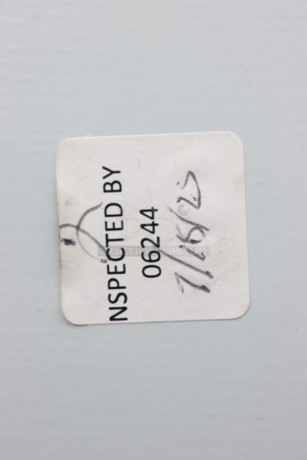Inspection sticker on a Scotsman UN1520AX-1 ice machine, marked "INSPECTED BY 06244, 7/16/12."