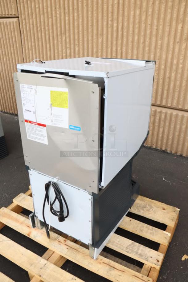 Brand new Scotsman UN1520AX-1 undercounter nugget ice machine, air-cooled, 57 lb. bin, 115V, slight scratches visible.