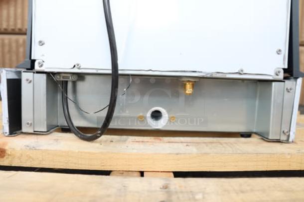 Brand new Scotsman UN1520AX-1 undercounter nugget ice machine, air-cooled, 57 lb bin, 115V, 1 phase; minor scratches.