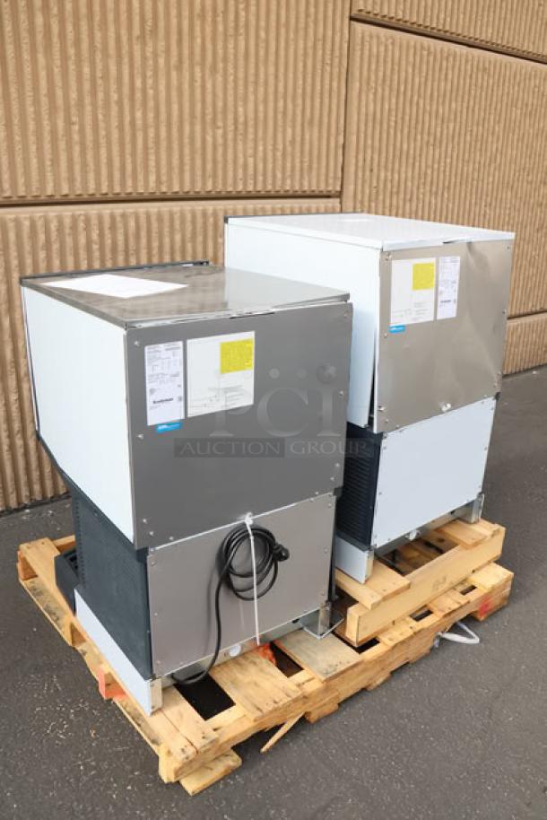 2 Scotsman HID525AB-1A countertop ice machines on pallet; scratch-n-dent, new condition, labels show serial numbers and specs.