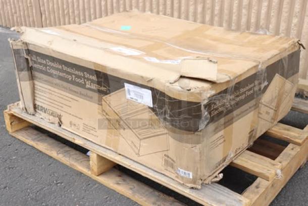Brand new ServIt FW200D dual well food warmer in opened, scratched packaging; model FW200D, 120V, 2000W, on pallet.