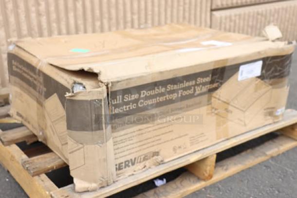 Damaged box of ServIt FW200D dual well electric countertop food warmer. New, scratch-and-dent condition. Model marked on box.