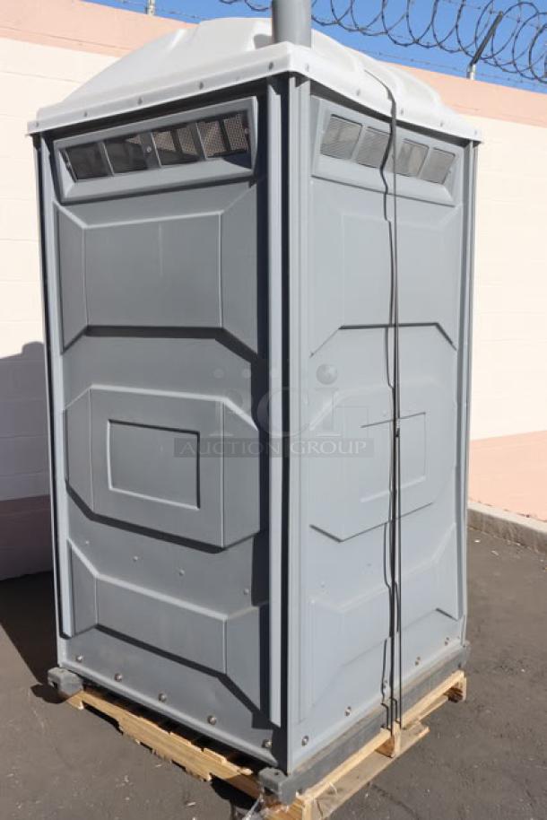 BRAND NEW PolyJohn PJN3-1005 pewter portable restroom with translucent top, assembled, on pallet, out of original packaging.