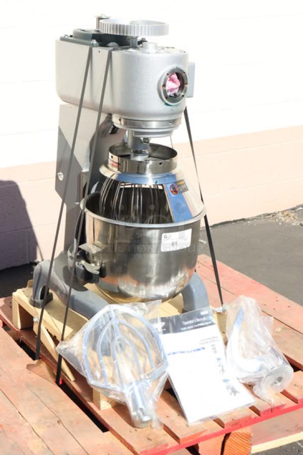 Vollrath 40757 20 Qt. planetary stand mixer with guard, shown with accessories. Item is damaged but parts usable.