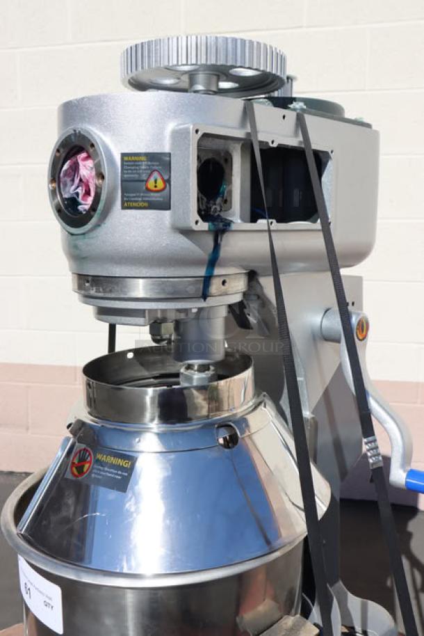 Vollrath 40757 20 Qt. Planetary Mixer, damaged with usable parts, includes guard and accessories, visible warning labels.