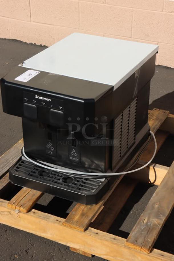 Brand new Scotsman HID207AX-1A Meridian nugget ice machine, touch-free dispensing, 7 lb. bin, air-cooled, 115V, on pallet.