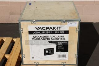 VacPak-It VMC32 chamber vacuum packaging machine in crate, features two 16" seal bars, oil pump, 120V, 9A, 1,180W. Brand new.