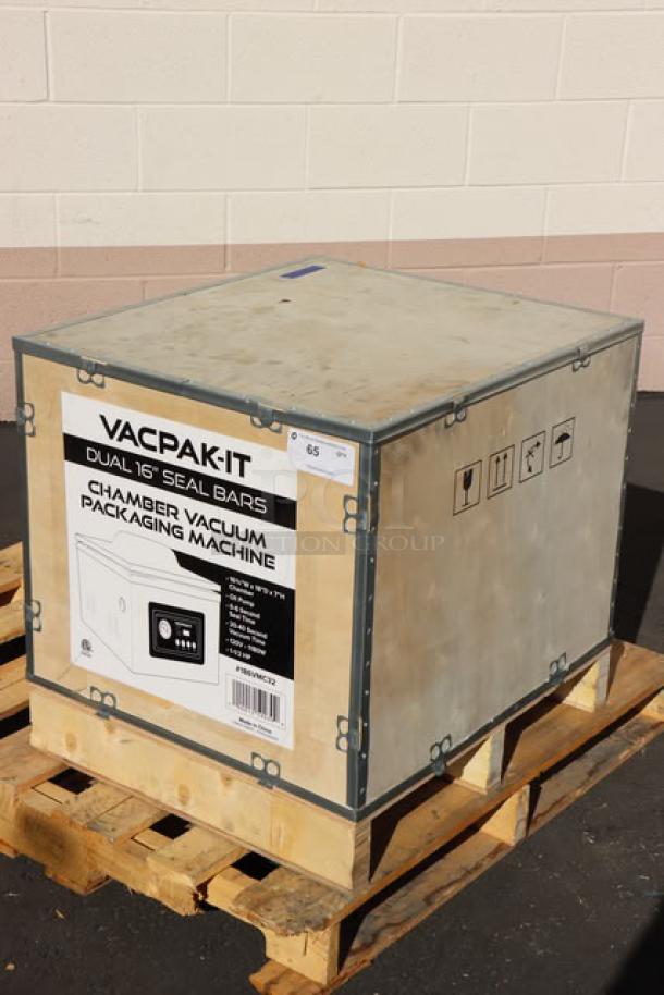 Brand new VacPak-It VMC32 chamber vacuum packaging machine, crated. Includes two 16" seal bars, oil pump, and specs label.