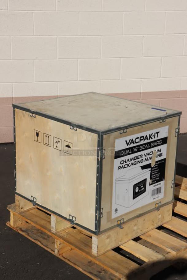 BRAND NEW VacPak-It VMC32 Chamber Vacuum Packaging Machine in crate with dual 16" seal bars, labels indicate specs and handling.