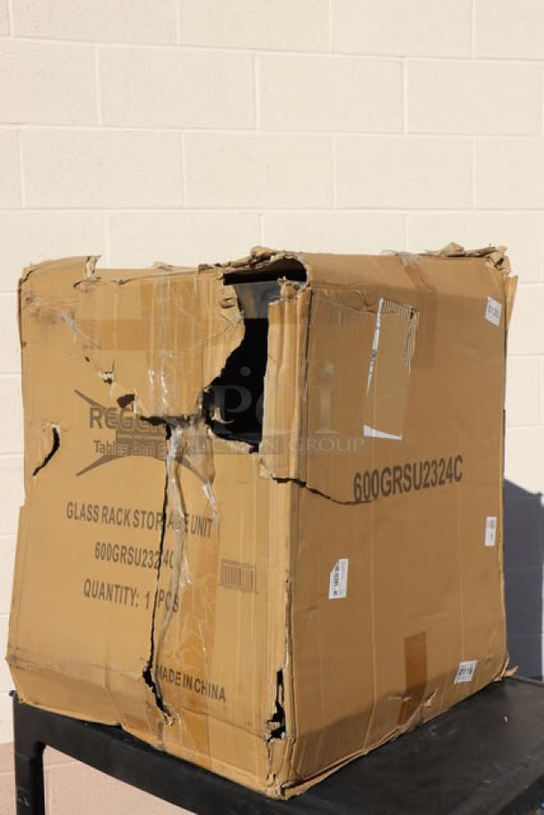 Damaged box containing new Regency 600GRSU2324C stainless steel glass rack storage unit, 23" x 24", marked as scratch-n-dent.