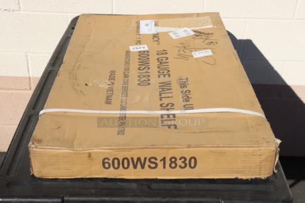 Boxed Regency 600WS1830 18" x 30" stainless steel wall shelf, 18 gauge, new scratch-n-dent, visible packaging wear.