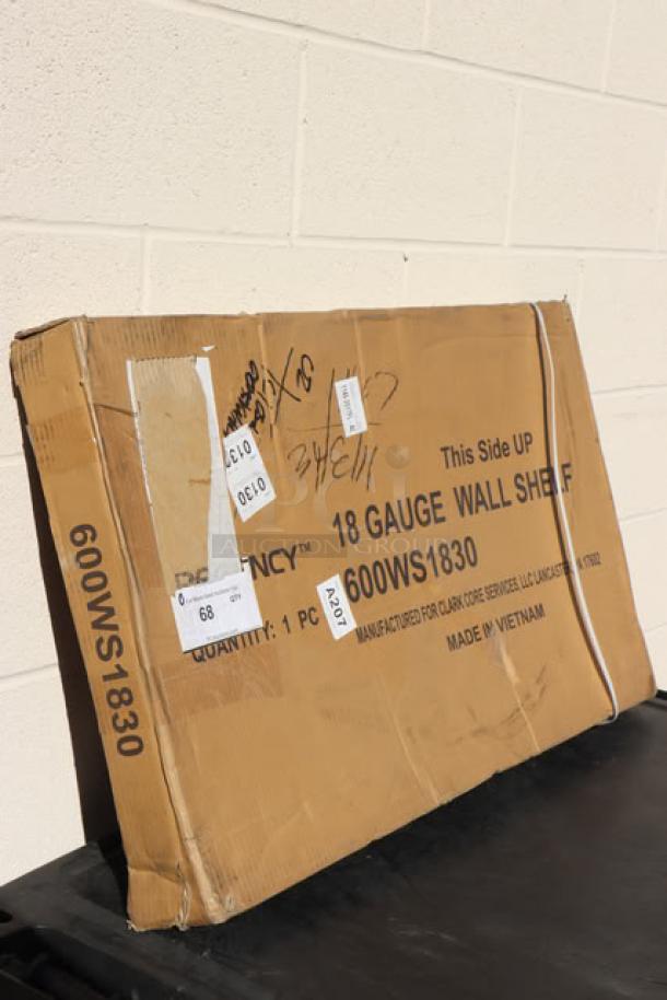 Brand new Regency 600WS1830 18"x30" 18-gauge stainless steel wall shelf in box, labeled as scratch-n-dent.