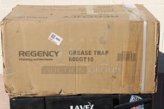 BRAND! Regency 600GT10 grease trap in damaged packaging; box shows scratching and denting. PDI certified, 20 lb., 10 GPM.