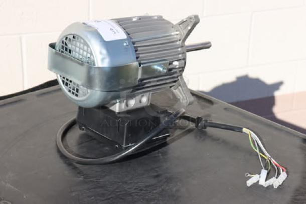 Blodgett 56966 blower motor, brand new, out of packaging, visible wiring, metal casing, ideal for industrial use.