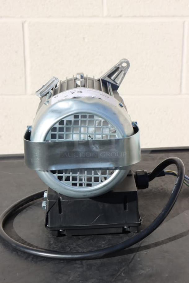 Brand new Blodgett 56966 blower motor, metal casing, out of original packaging, with attached wiring and mounting features.