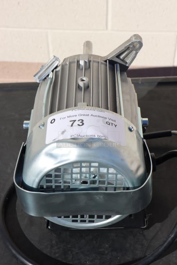 BRAND NEW Blodgett 56966 blower motor, out of original packaging, silver, auction label visible on top.