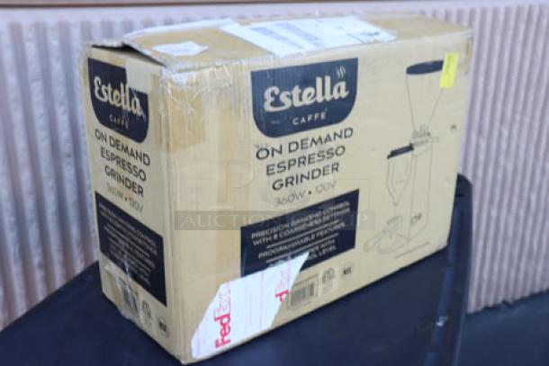 BRAND NEW Estella Caffe ECEGOD Espresso Grinder, 120V. Damaged original packaging, potential scratches/dents on unit. Box label visible.
