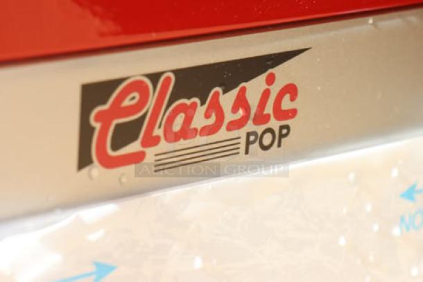 Paragon Classic Pop 14 oz. popcorn machine, model 1112810. "Classic Pop" label visible. Glass pane broken. Brand new, scratch-n-dent.