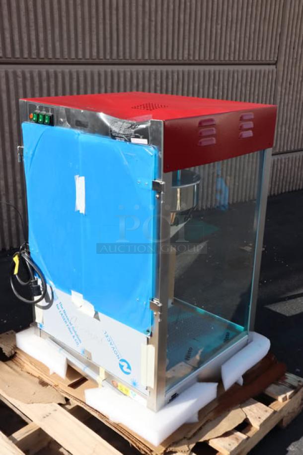 Cretors T-3000 popcorn popper, 12 oz capacity, 120v, unboxed, red top, dent on backside, serial number visible.