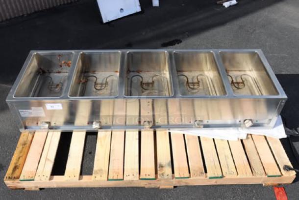 BRAND NEW ServIt 423ESTSWOPB five-pan electric steam table, partially enclosed base, serial number visible. Wells are dirty.