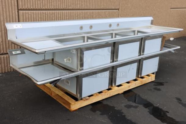 Regency 600S32424224 stainless steel commercial sink, three 24"x24"x14" bowls, 2 drainboards, minor dents, unboxed.