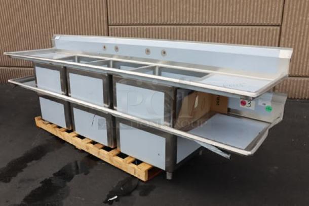 Regency 600S32424224 stainless steel three-compartment sink with 2 drainboards, 124", 16-gauge, out of packaging, minor dents.