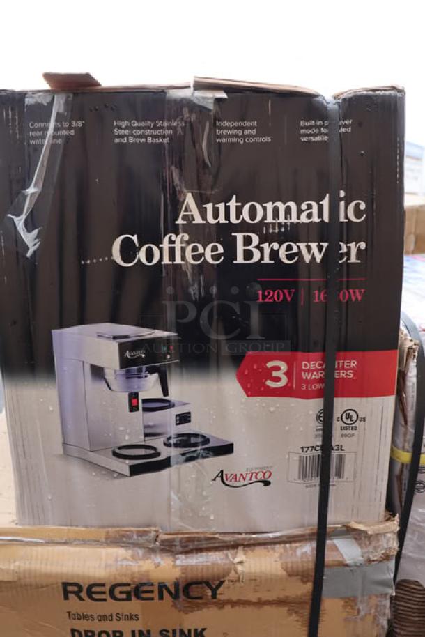 Boxed Avantco automatic coffee maker with 3 lower warmers, 120V, 1650W. Visible wear; packaging box is wet and slightly damaged.