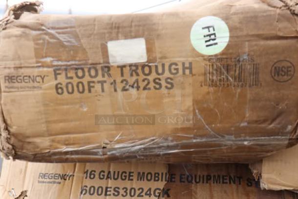 Damaged boxes containing Regency floor trough and mobile equipment stand. Boxes are wet with potential scratches or dents.