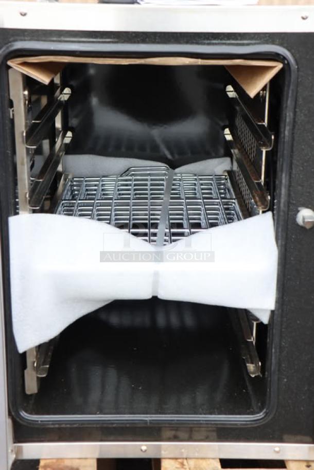 Moffat E33D5-P convection oven interior, new but unboxed, possible minor dents. Includes racks, 208V, 1 Phase, 6 kW.