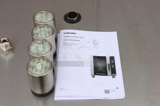 Moffat E33D5-P oven accessories and manual; includes steam injection parts; slight surface wear visible.