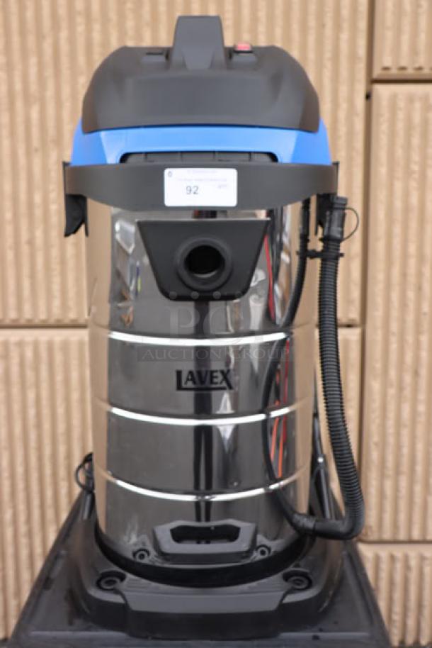 Brand new Lavex 944BJ14126G 26-gallon stainless steel wet/dry vacuum, 100-120V, 1400W, with toolkit. Model label visible.