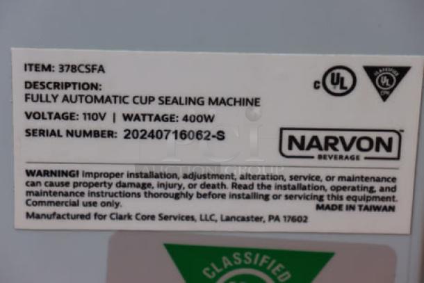 Brand new Narvon automatic cup sealing machine, model 378csfa, 110V, 400W, S/N: 20240716062-S, with labels showing specifications and warnings.