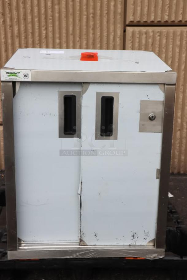 BRAND NEW Regency 600WCS1524 24" stainless steel wall cabinet, sliding doors, minor scratches and dents visible, model tag present.