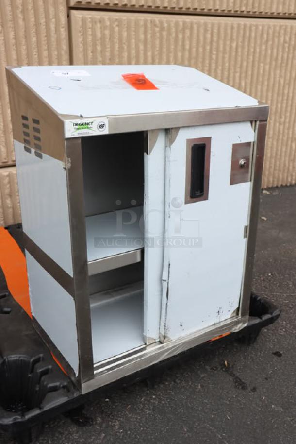 BRAND NEW SCRATCH-N-DENT Regency 600WCS1524, 24" stainless steel wall cabinet with sliding doors, visible minor dents.