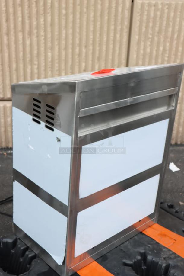 Brand new Regency 600WCS1524 24" stainless steel wall cabinet with sliding doors, visible scratch and dent, exterior labels.