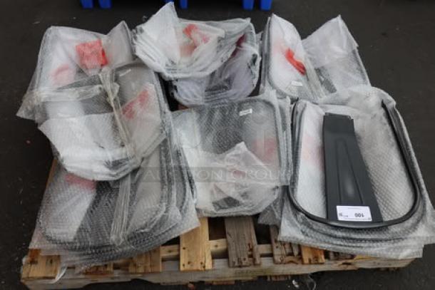 Brand new Lancaster Table & Seating metal chair back rests, black, bubble-wrapped on pallets, 35 units.