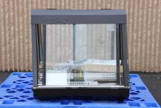 Brand new Avantco HDC-26 heated display case, 26", 3 shelves, sliding doors. Minor scratches, model number visible.
