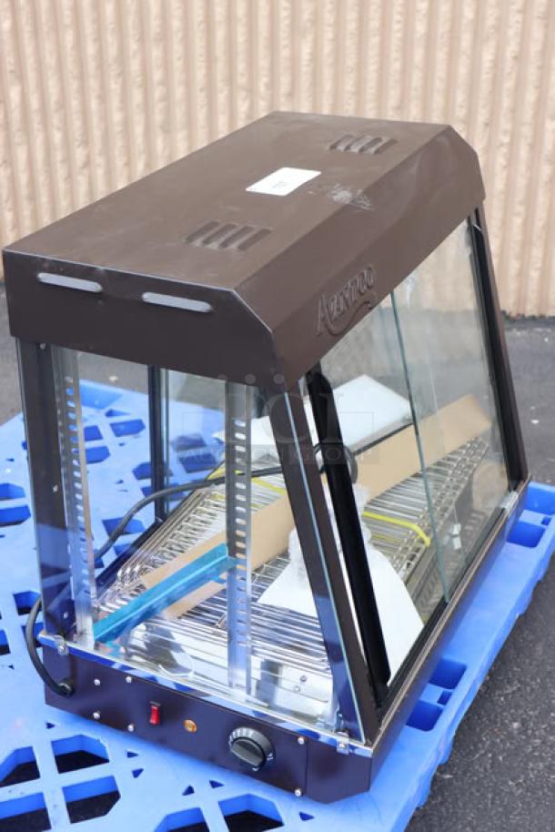 Brand new Avantco HDC-26 heated display case, 3 shelves, sliding doors, 26", 120V, 1580W, minor scratches.