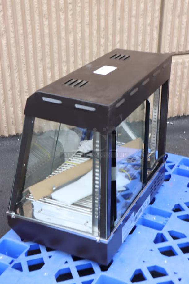 Avantco HDC-26 heated display case, 26", new scratch-n-dent, 3 shelves, sliding doors, black, 120V, on blue pallet.