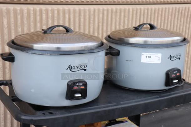 Brand new Avantco RCB124 electric rice cookers, 124-cup capacity. Two units on a cart. Each features a removable lid.