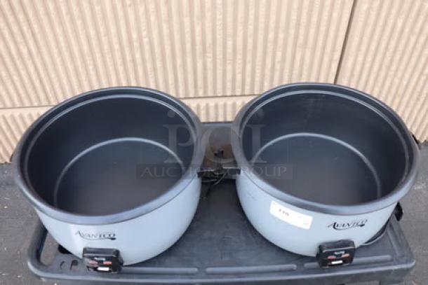 Brand new Avantco RCB124 rice cookers, 124-cup capacity, visible tags with serial numbers, slight dents noted.
