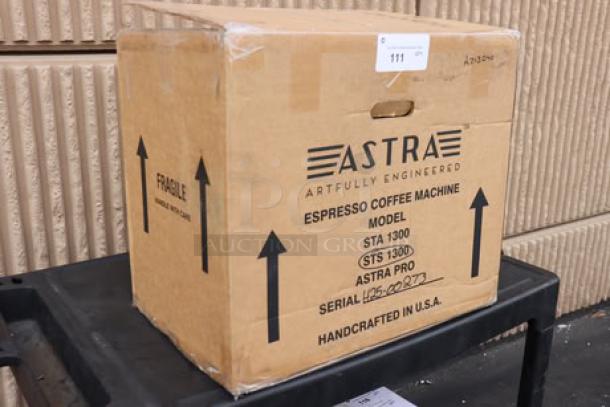 Brand new Astra STS1300 Pro Semi-Automatic Steamer in original packaging, labeled with model and serial number.