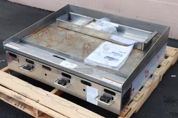 BRAND NEW Wolf by Vulcan AGM36-NAT 36" gas griddle, 81,000 BTU, manual controls, surface rust, on pallet.