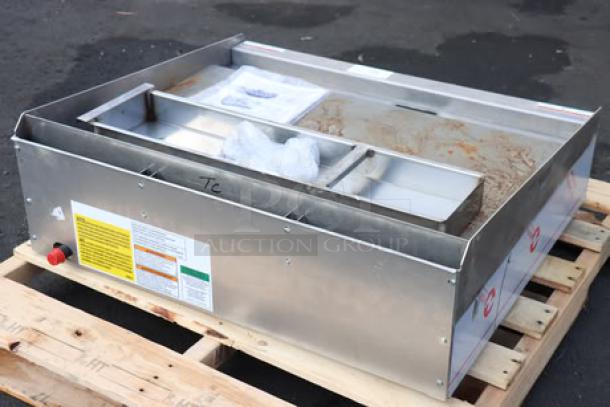 Wolf by Vulcan AGM36-NAT 36" gas griddle, brand new with manual controls, 81,000 BTU, surface rust visible, serial 650257571.