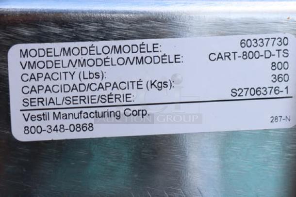 Vestil CART-800-D-TS label showing model, capacity of 800 lbs, and serial number S2706376-1. Cable needs replacement.